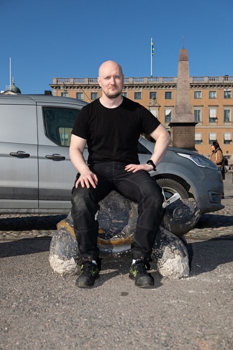 Miro Nuutinen sitting on the Market Square.