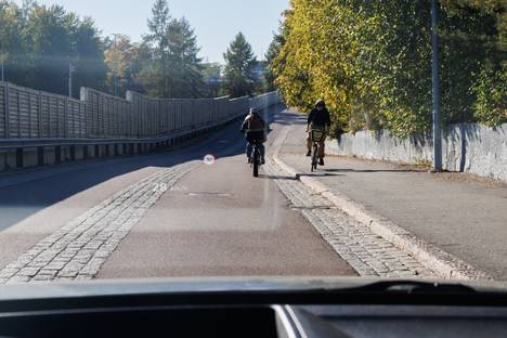 Some cyclists prefer to ride on the sidewalk rather than on the bike lane.