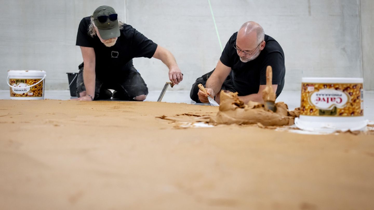 Dutch museum floor covered in peanut butter in honor of late artist