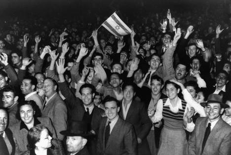 Jewish state supporters celebrate in the streets of Tel Aviv in November 1947 after the UN General Assembly passed a resolution proposing the partition of British-ruled Palestine into Jewish and Arab states.