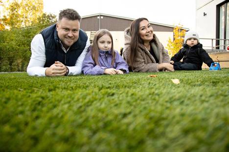 The family is satisfied with their choice of grass.