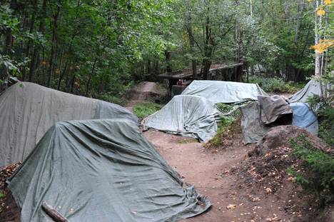 Jumpers are covered with tarps.